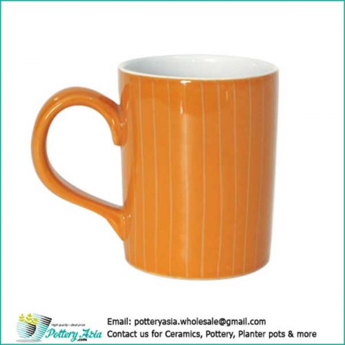 Ceramic mug orange color glaze with stripes
